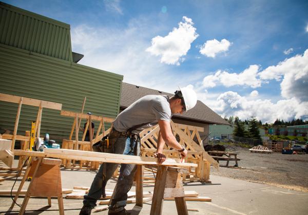 A Carpentry Apprenticeship student working on his wooden project