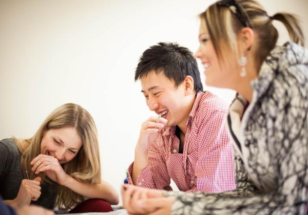 A group of three Culinary Management students having fun at their group project