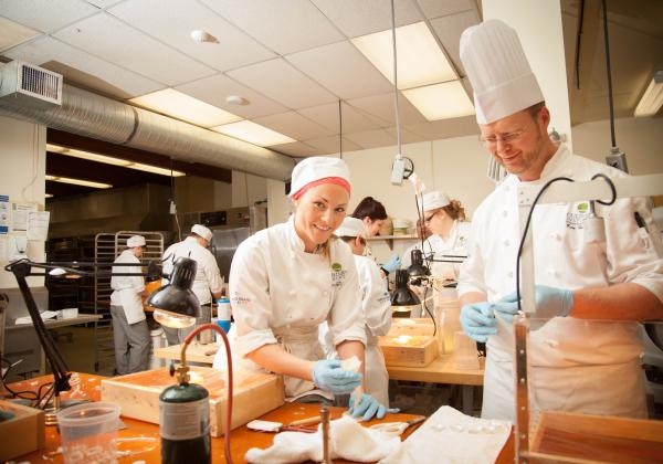 Students of the Professional Baking and Pastry Arts program decorating tasty treats at VIU's baking school